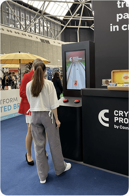 CoinsPaid exhibition stand with Money Racing game